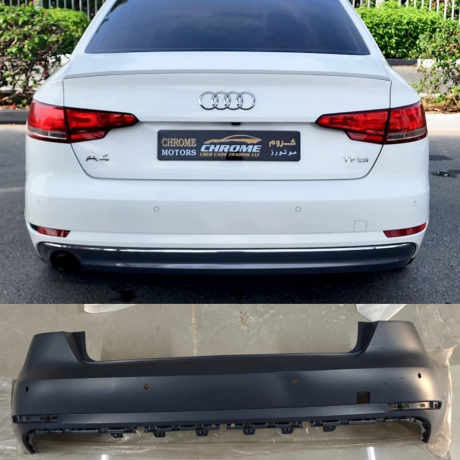 Audi A4 8W rear bumper with model details and part number on a white car.