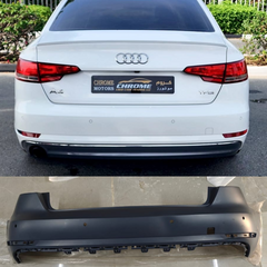 Audi A4 8W rear bumper with model details and part number on a white car.